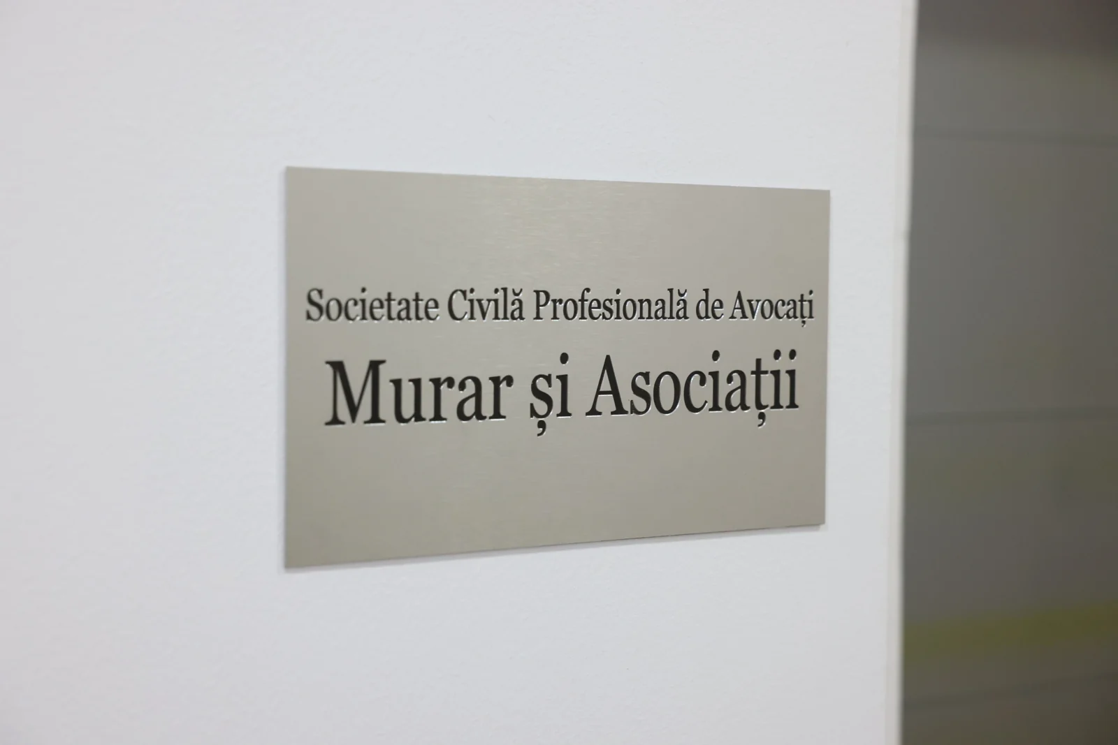 The Murar și Asociații office plaque